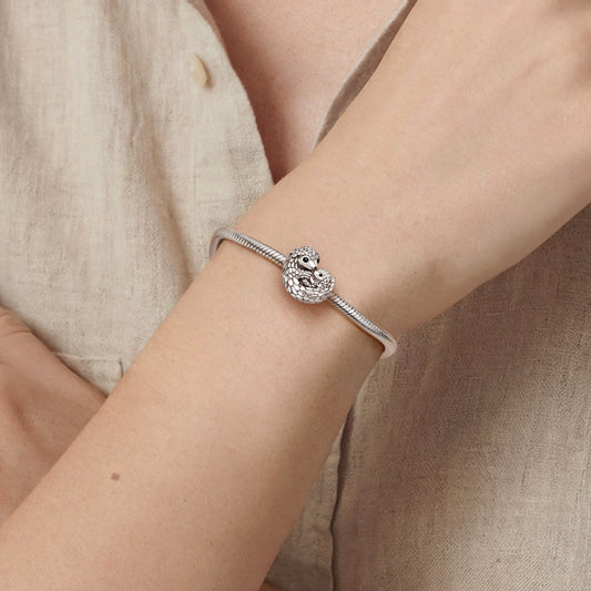 Gnoce Pangolin Embraces Baby Charm_2